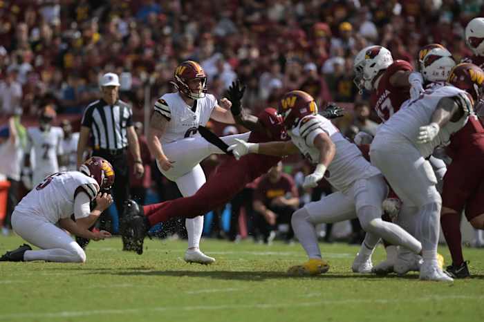 Washington Commanders place kicker Joey Slye (6) kicks the eventual game winning field goal against the Arizona Cardinals during the fourth quarter at FedExField.